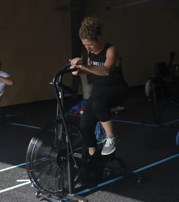 CrossFit Inguz Testimonial Woman on Bike
